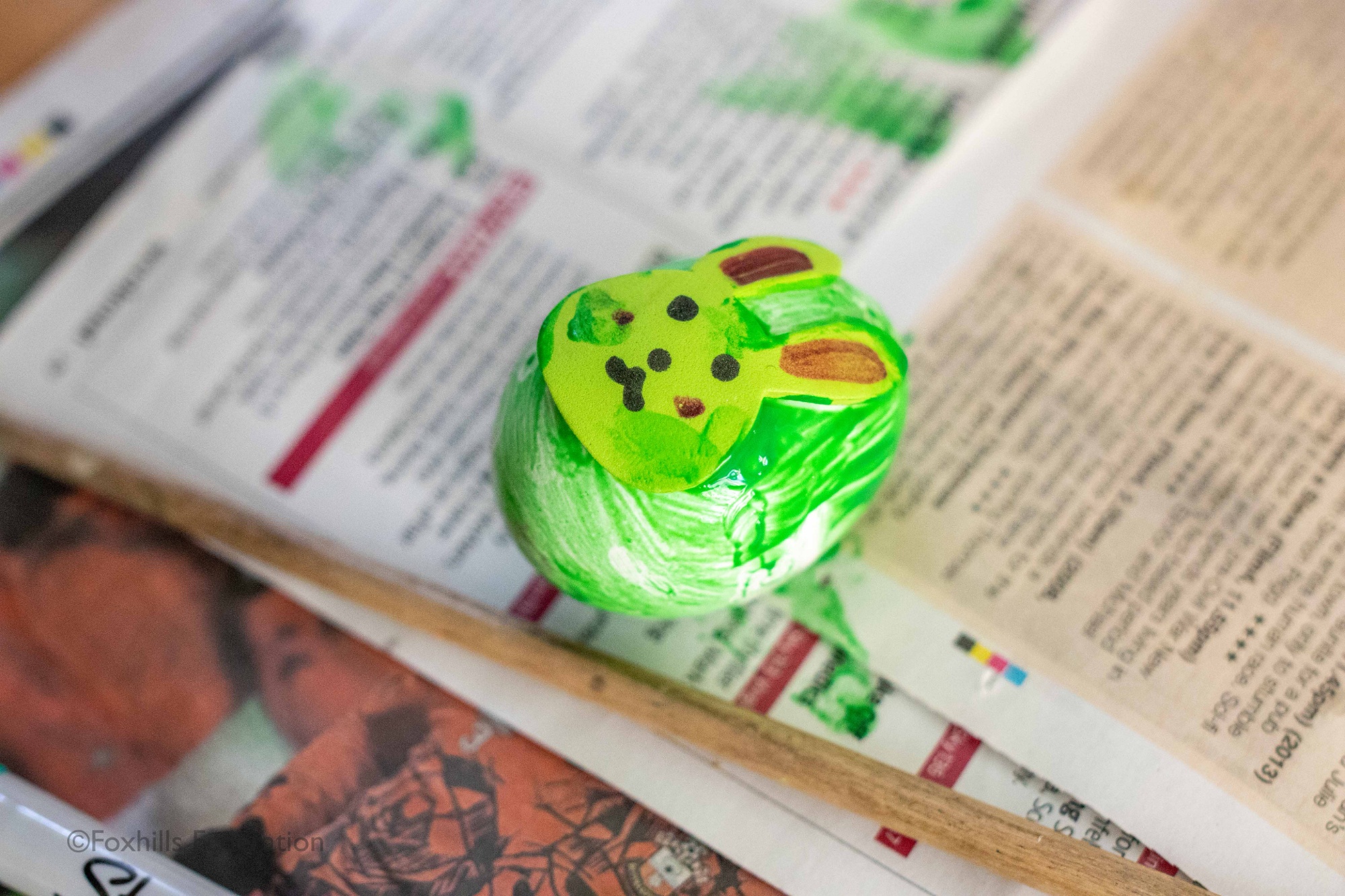 A green egg with a bunny on it