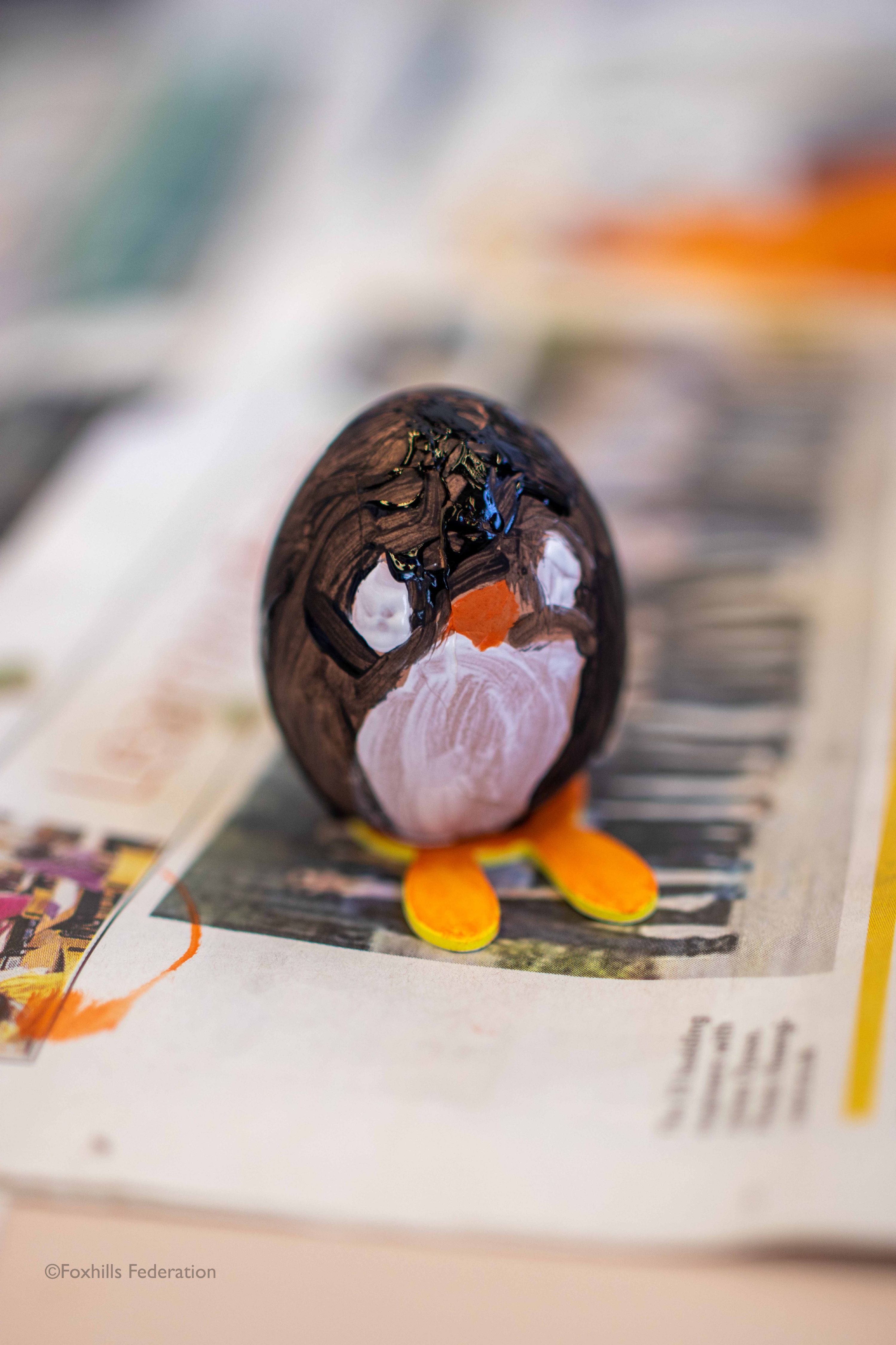 A egg painted like a penguin