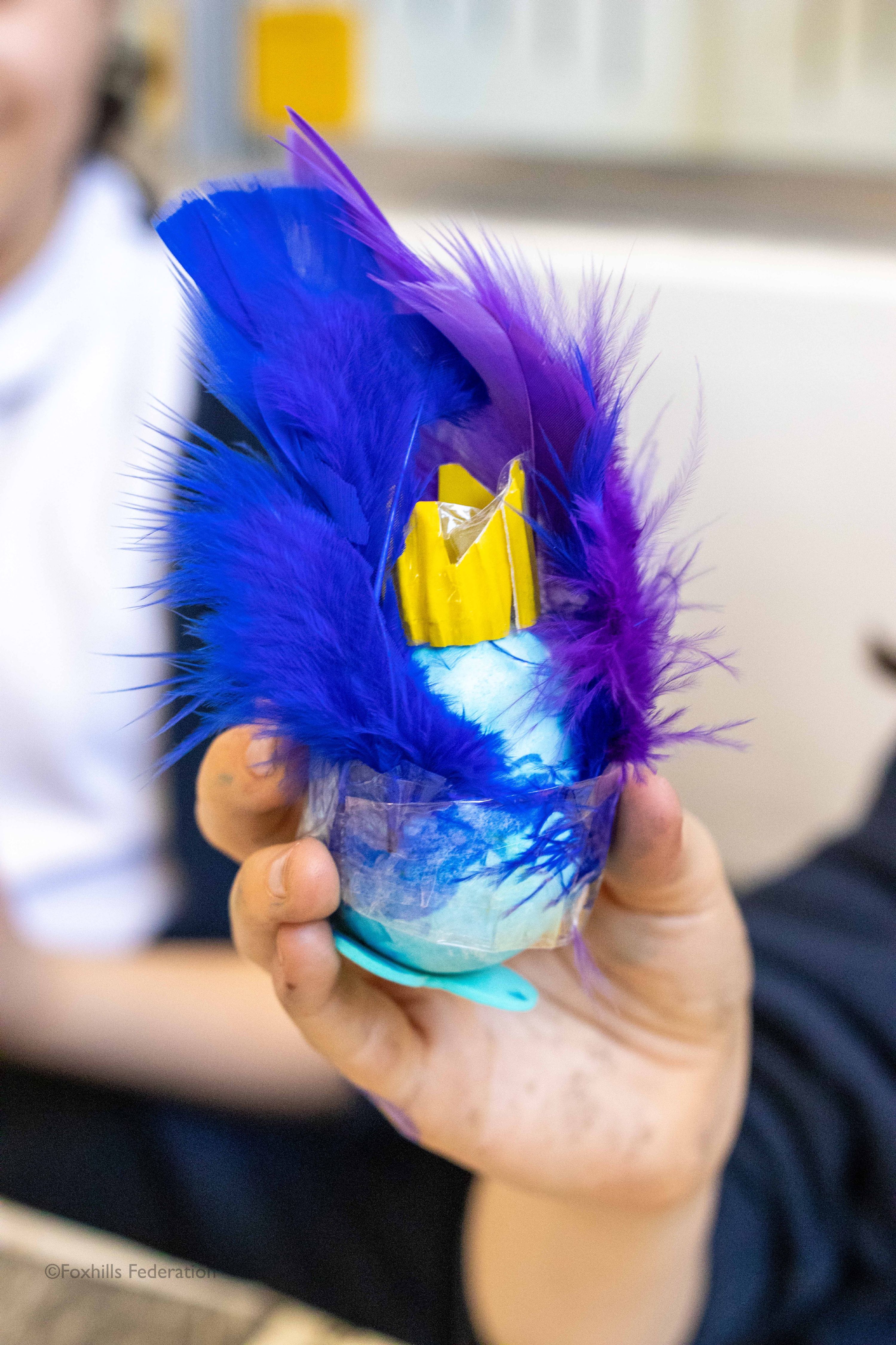 A egg painted as a peacoak