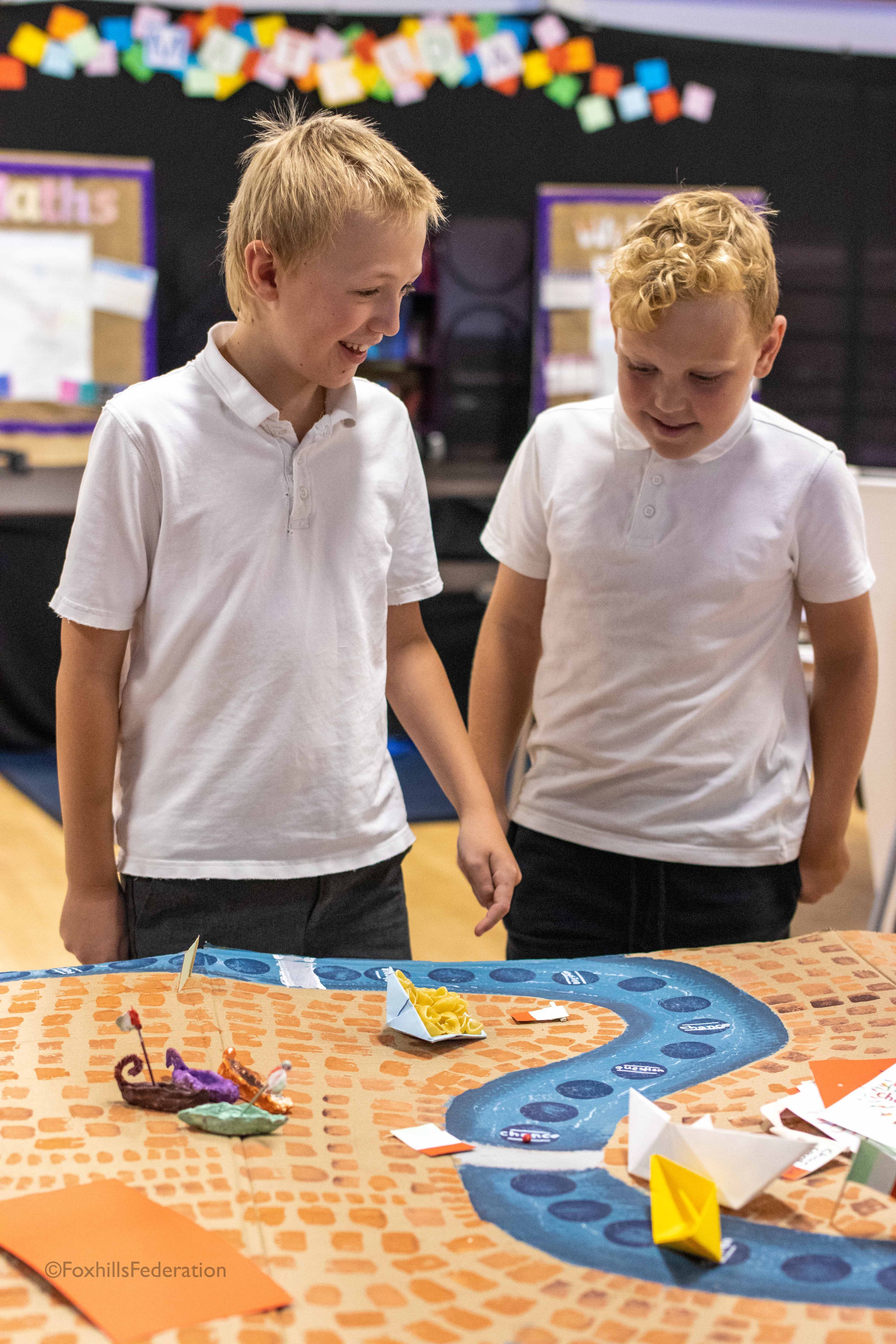 Boys enjoy looking at a artwork