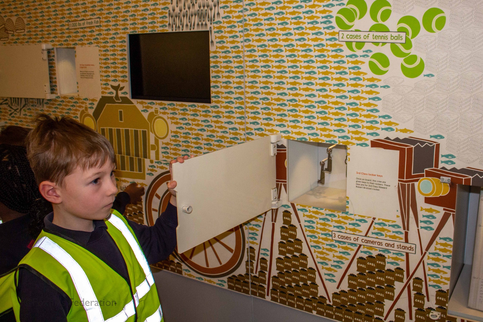 Children look at exhibits in the SeaCity museum.