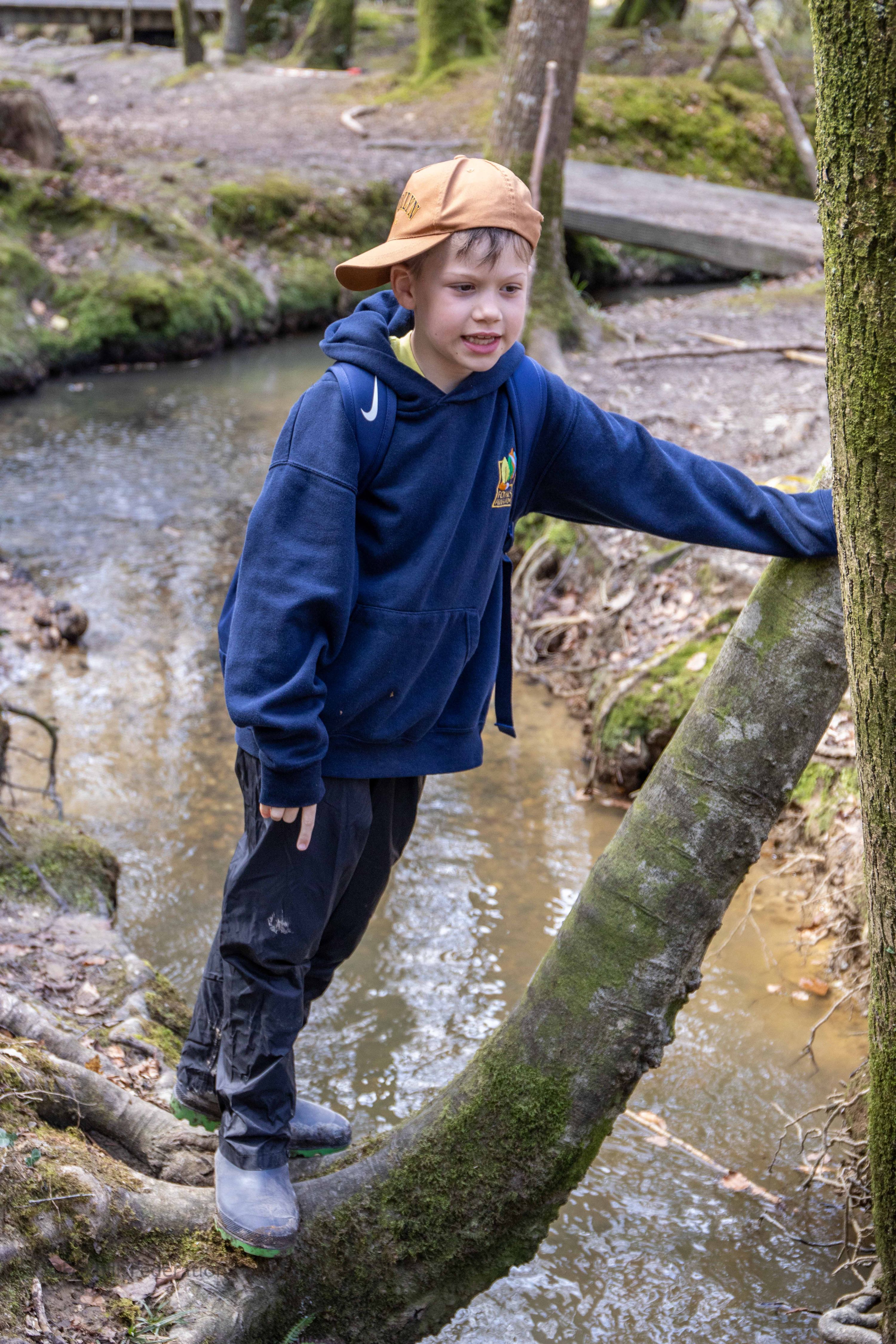 A boy watches the river