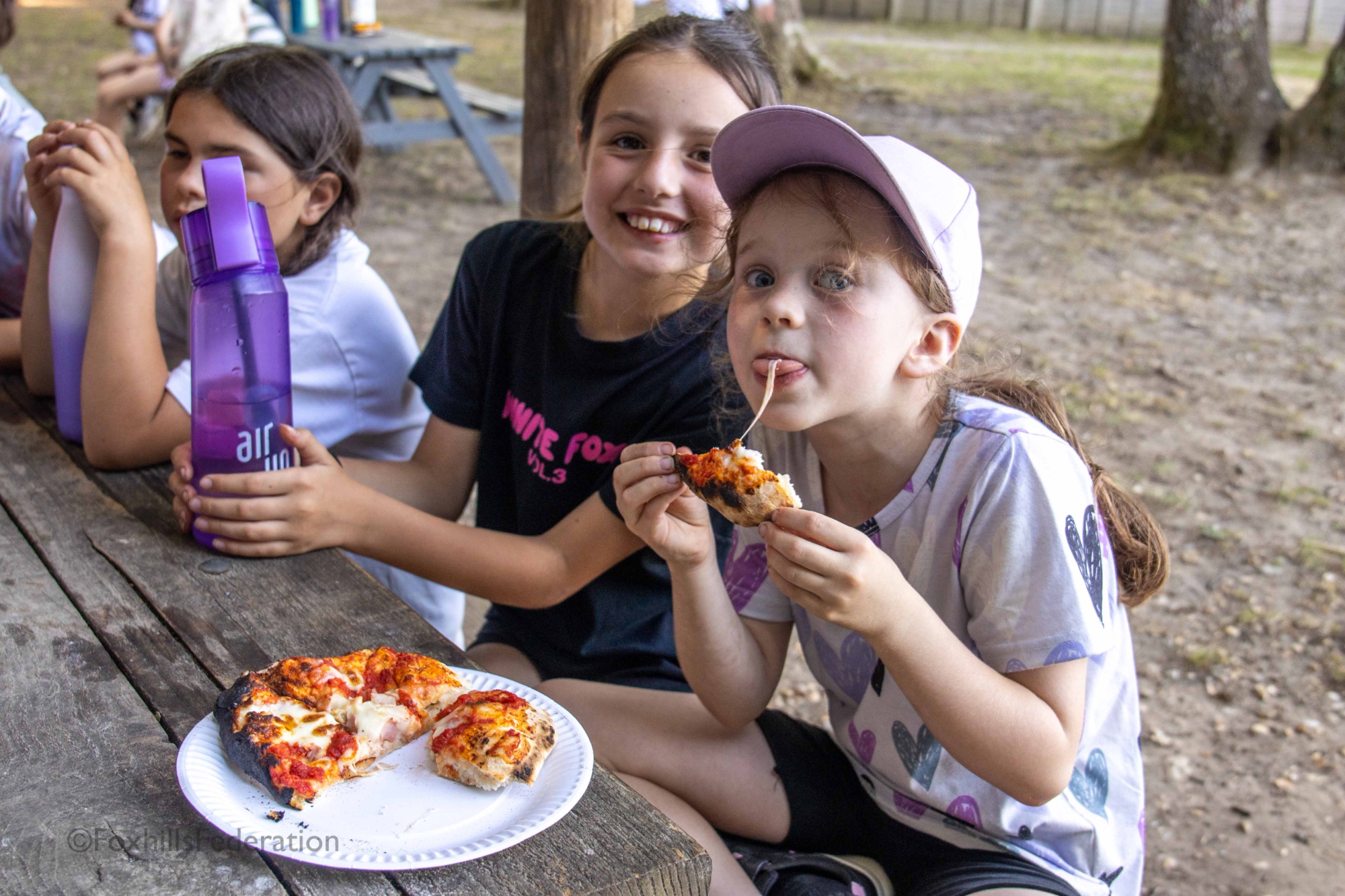 A girl eats homemade pizza