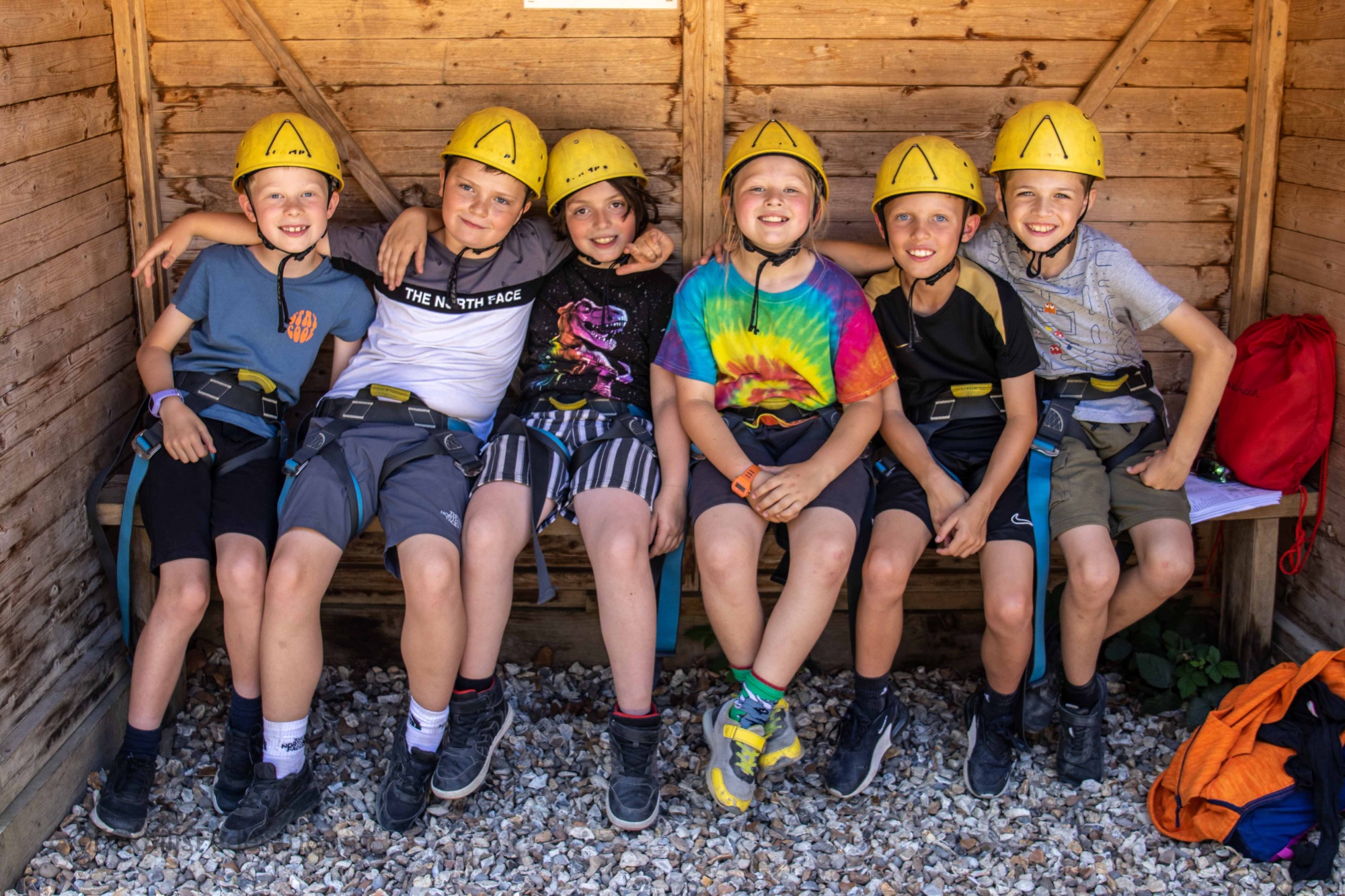A group of children smile at the camera