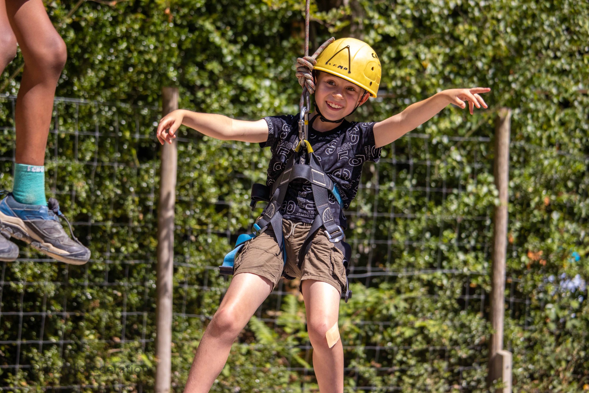 A boy hangs in the air