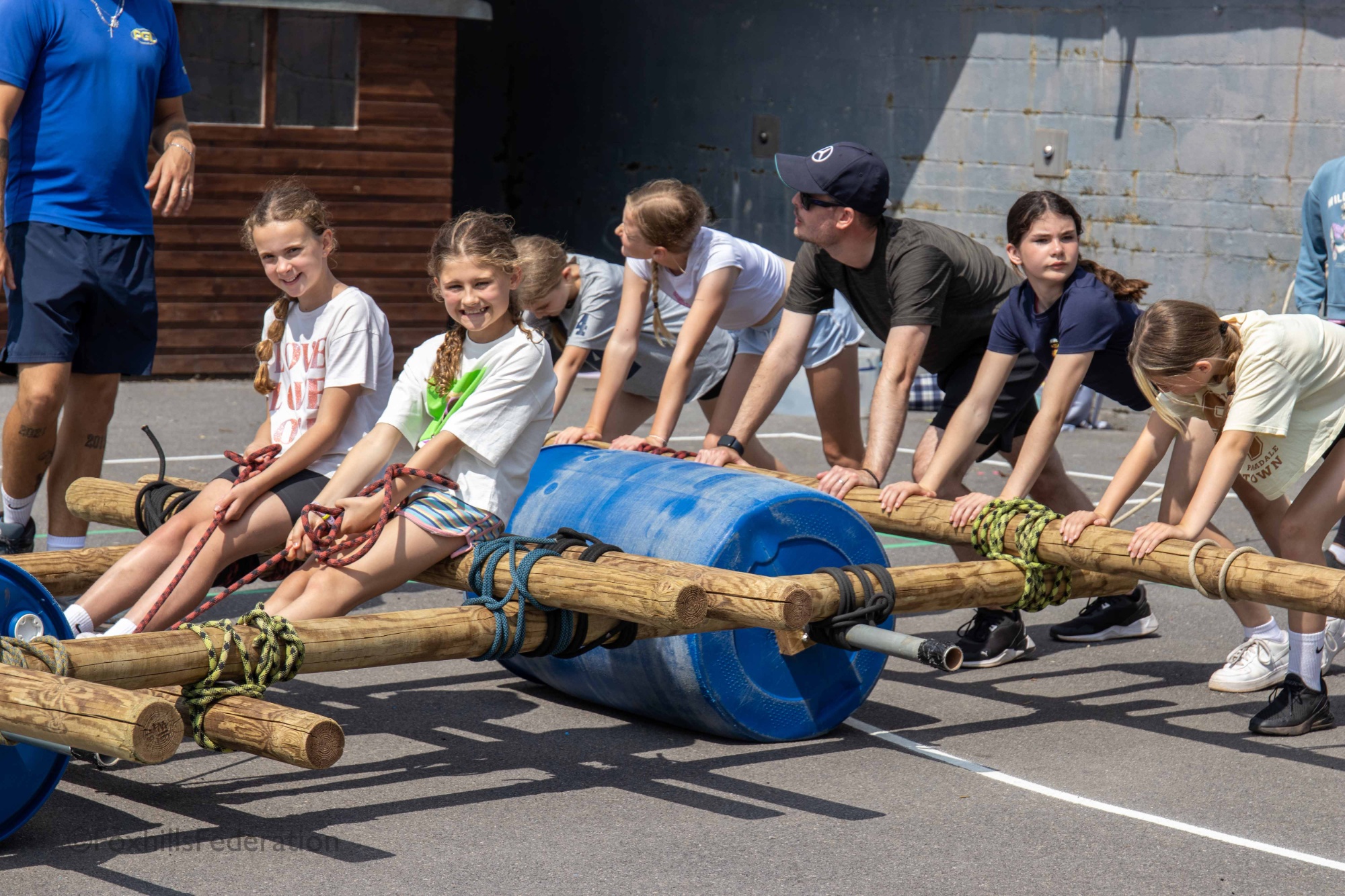 A children push a handmade buggy