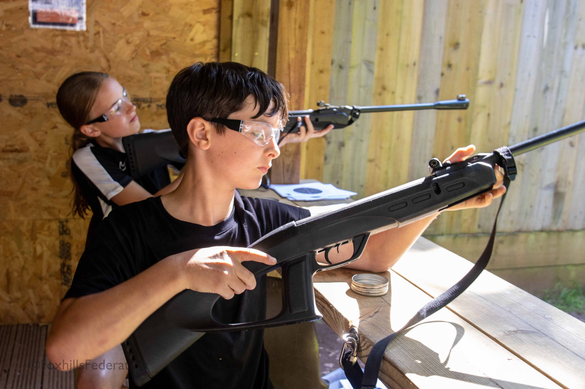 A boy shoots a gun