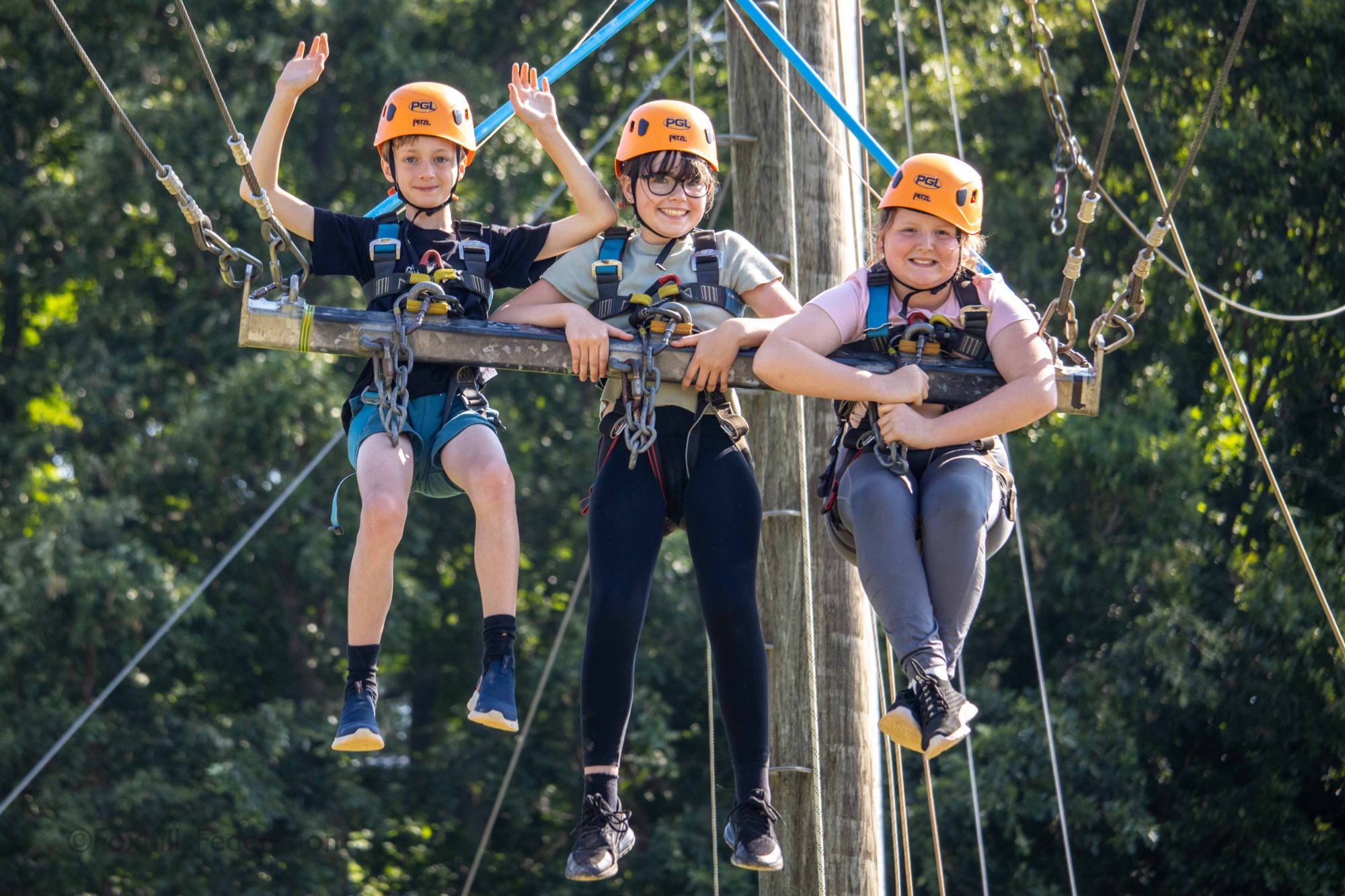 Children scream on the giant swing