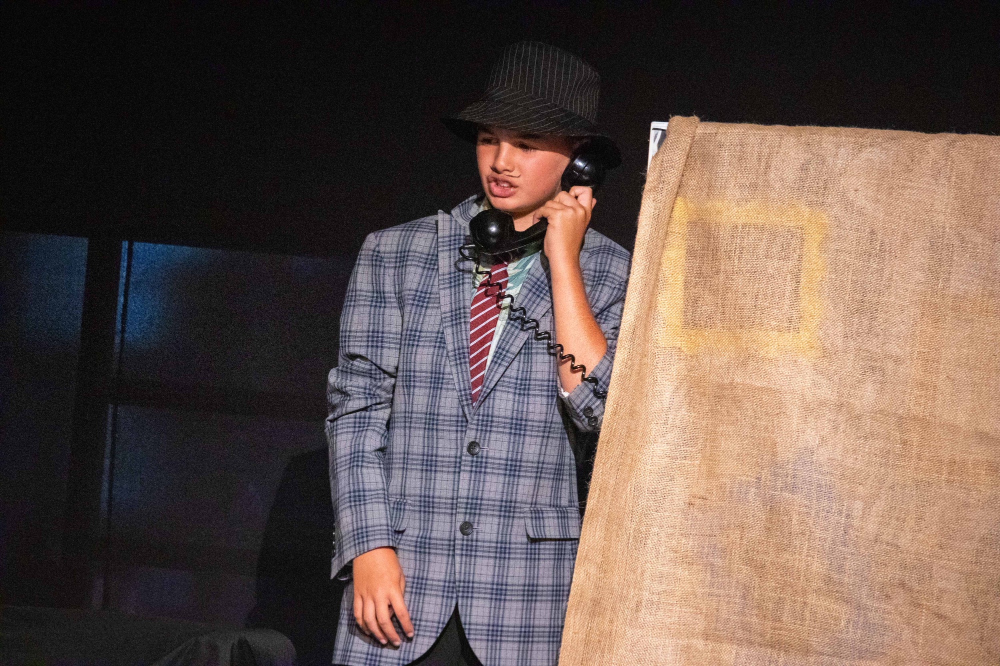 Mr Wormwood talks on a phone