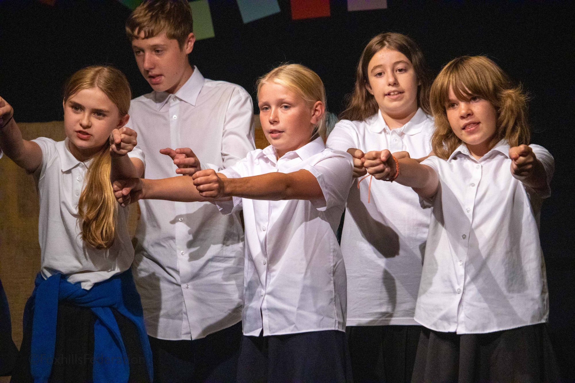 The children of Crunchem Hall sing the "School Song"