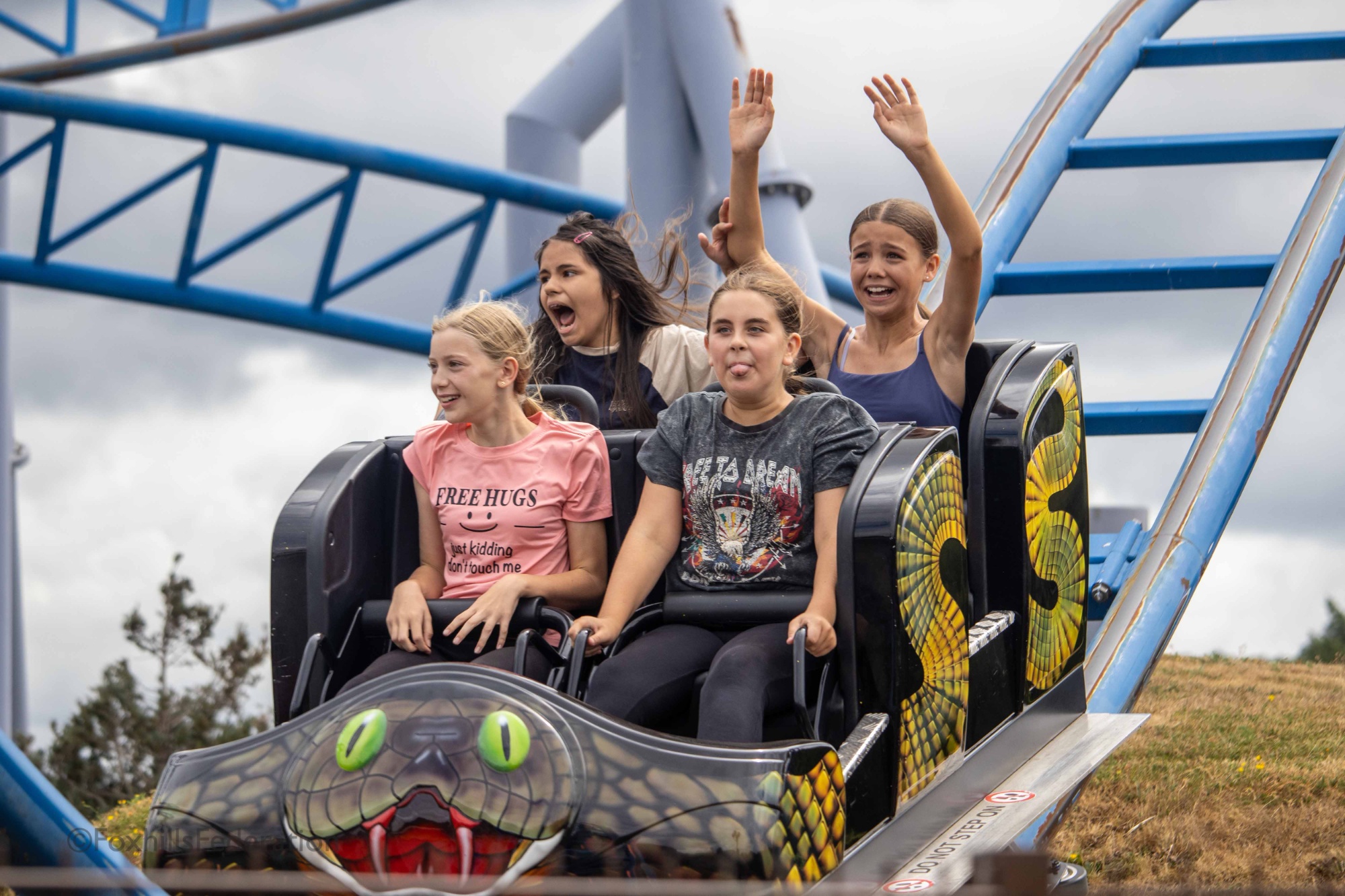 Children scream on a rollercoaster