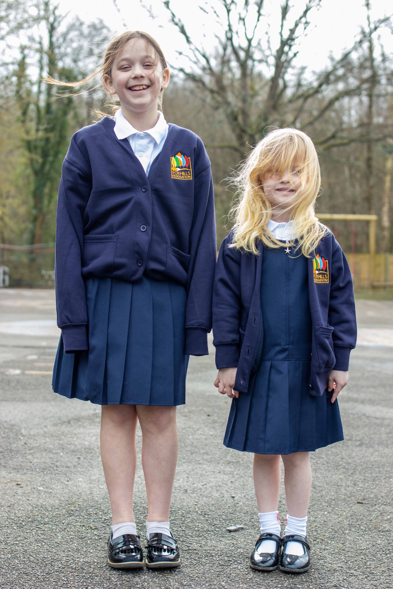 Girls showing the correct school uniform.