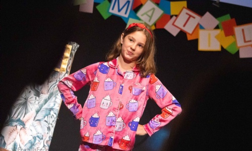 A photo from the Year 6 school play showing Matilda with her hands on her hips