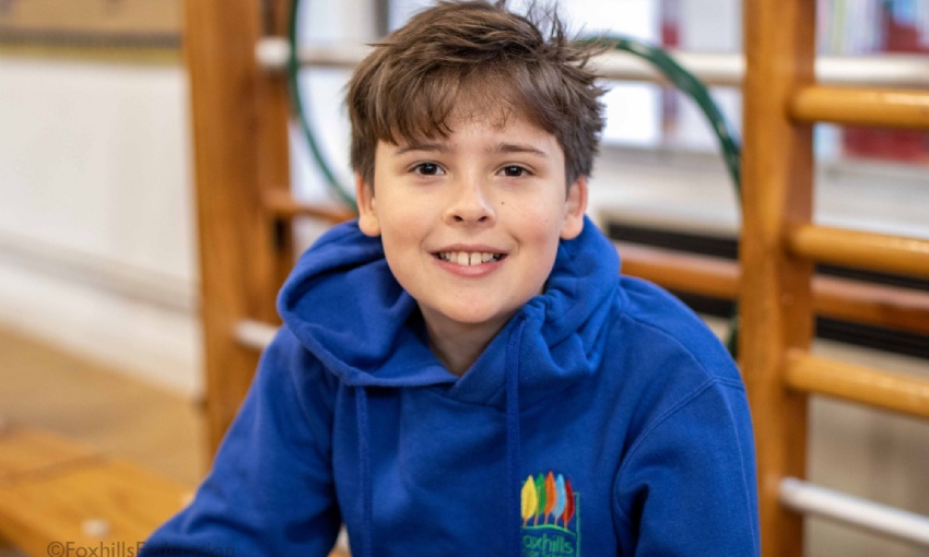 Boy smiles before his SATs exam.